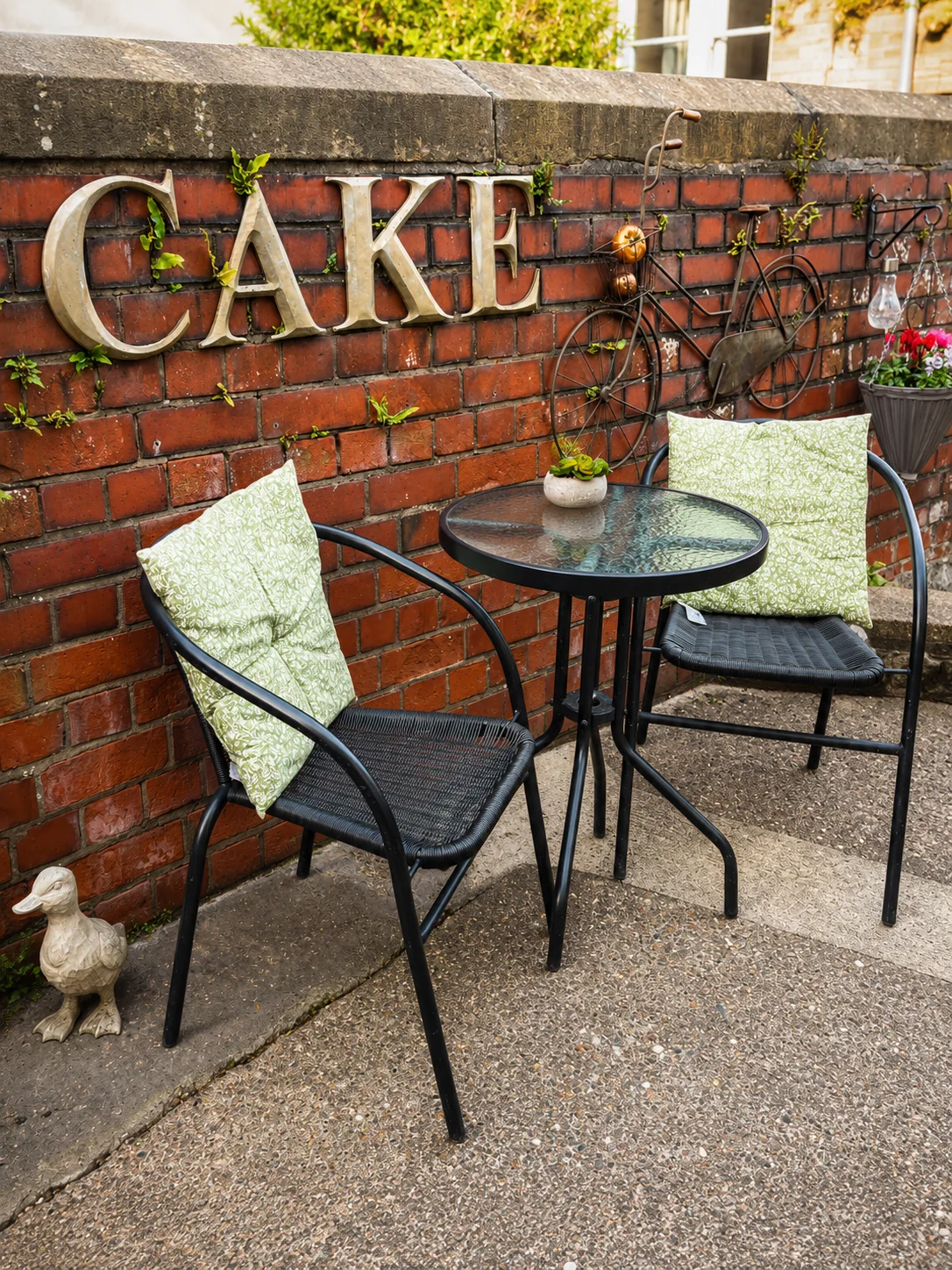 Outdoor seating beside the brick wall